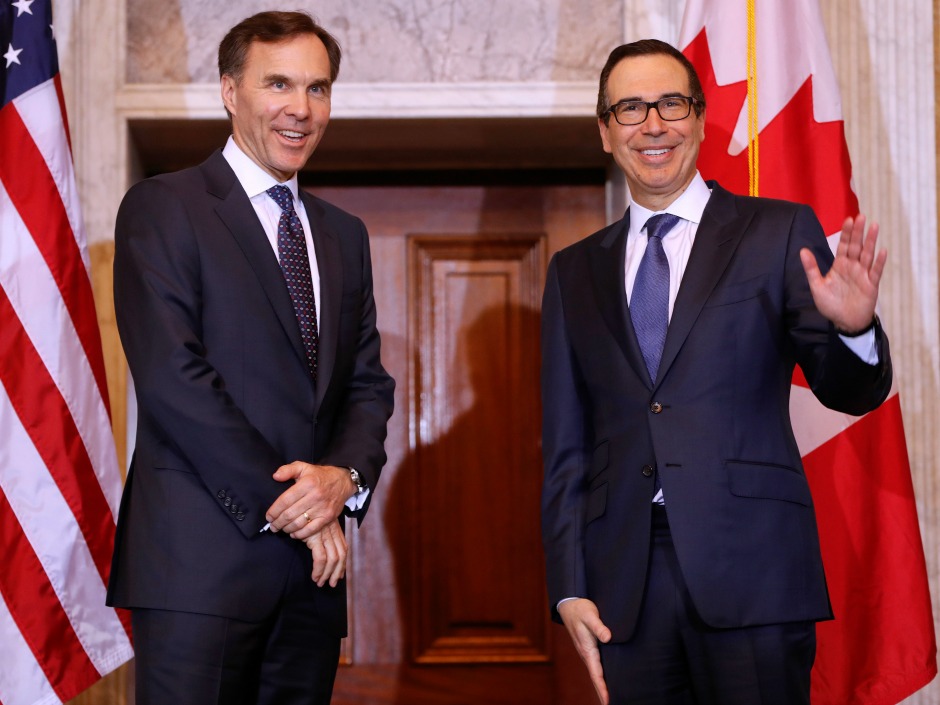 Treasury Secretary Steven T. Mnuchin, right, with Canadian Finance Minister William F. Morneau, left, before the start of their bilateral meeting at the U.S. Treasury Building in Washington, Wednesday, March 1, 2017. (AP Photo/Pablo Martinez Monsivais)