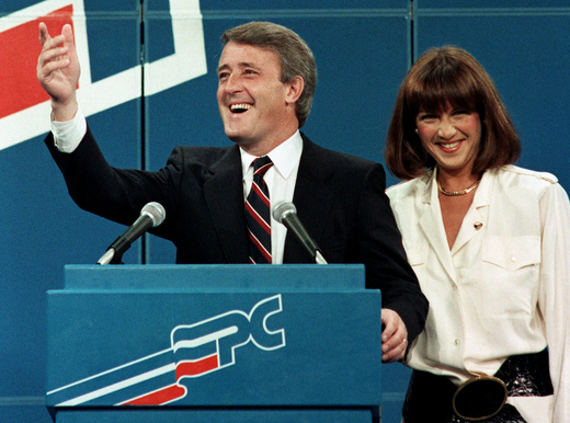 Brian Mulroney and Mila wave from the stage on election night Sept. 4, 1984. (CP PHOTO/stf)